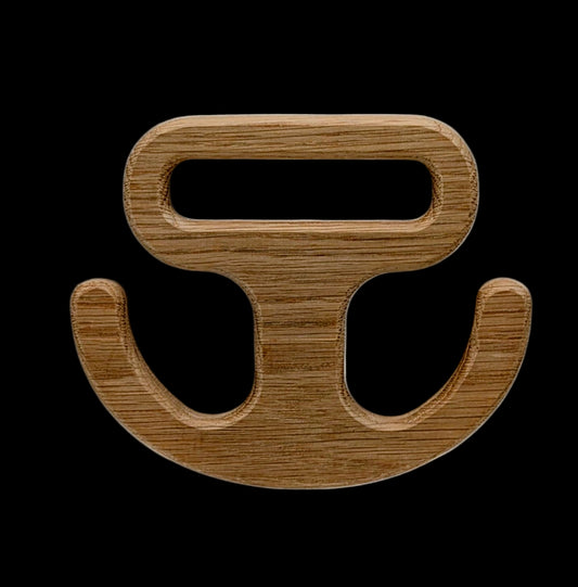 Solid hardwood grocery bag carry handle shaped like an anchor, with a smooth ergonomic grip and rectangular cutout for easy carrying of heavy shopping bags.